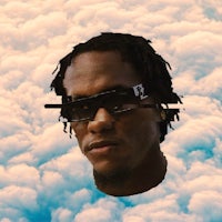 a man wearing sunglasses in the clouds